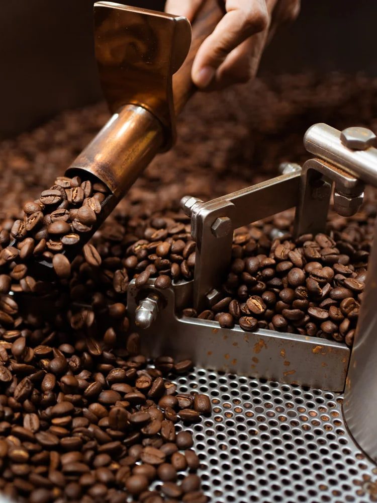 Beans tumbling from the chute into the roaster’s cooling tray