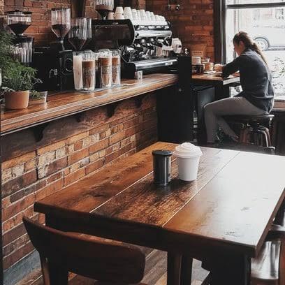 The communal table, and the bar behind it